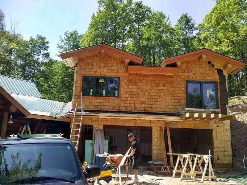 Raised treehouse with stairs and a front deck