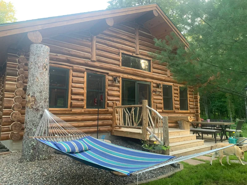 Cabin exterior with open wall areas during renovation
